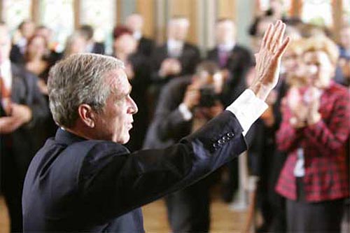 George Bush waves after speech