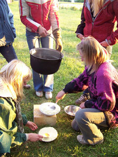 Preparing traditional Midsummer cheese